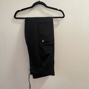 Figs scrubs with Aya logo